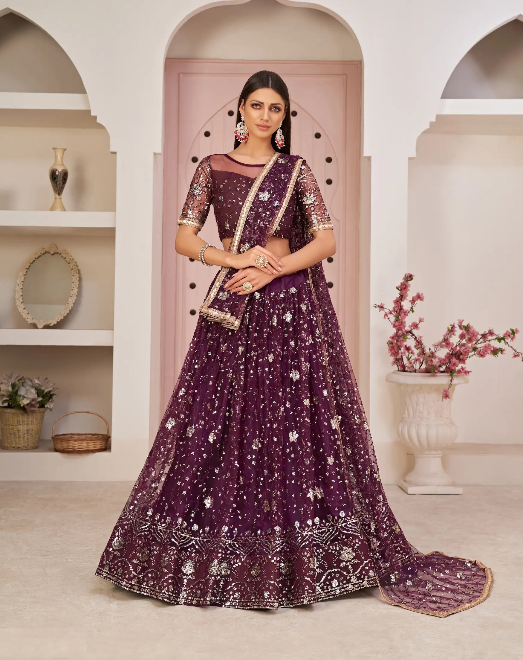 Wine Net Lehenga With Zari Sequins Thread Embroidery