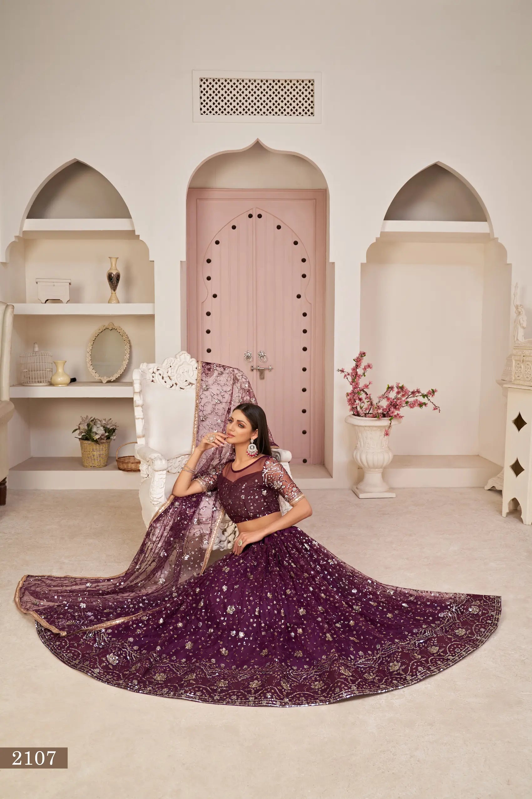 Wine Net Lehenga With Zari Sequins Thread Embroidery