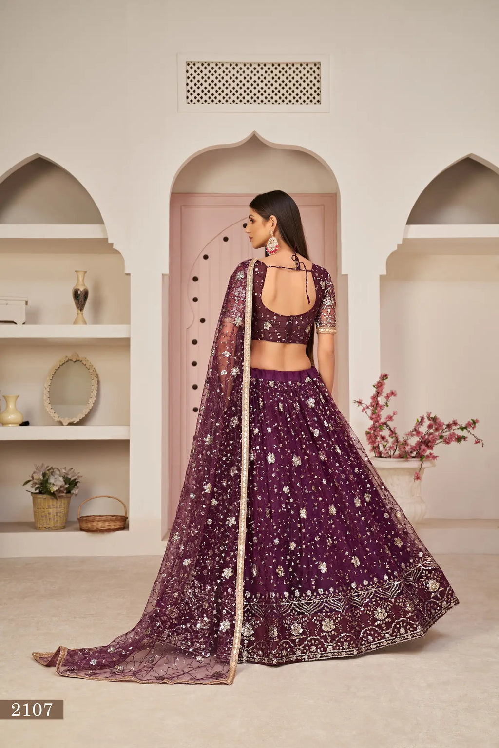 Wine Net Lehenga With Zari Sequins Thread Embroidery