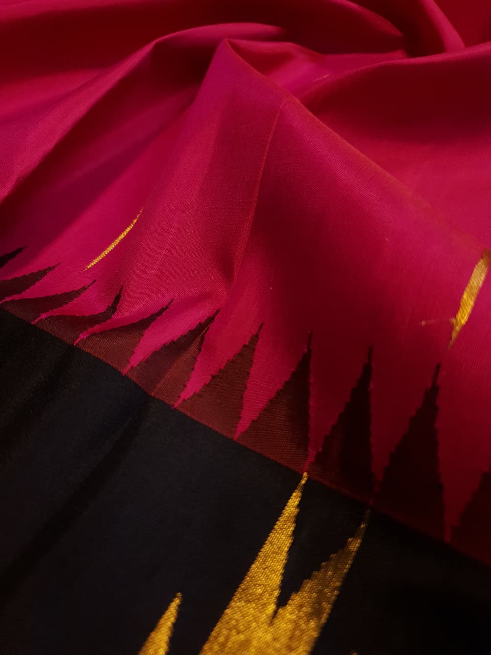 Dark Pink Kanchipuram handloom korvai temple silk saree featuring black and gold zari temple borders, a rich gold zari pallu, and a certified silk mark weave.