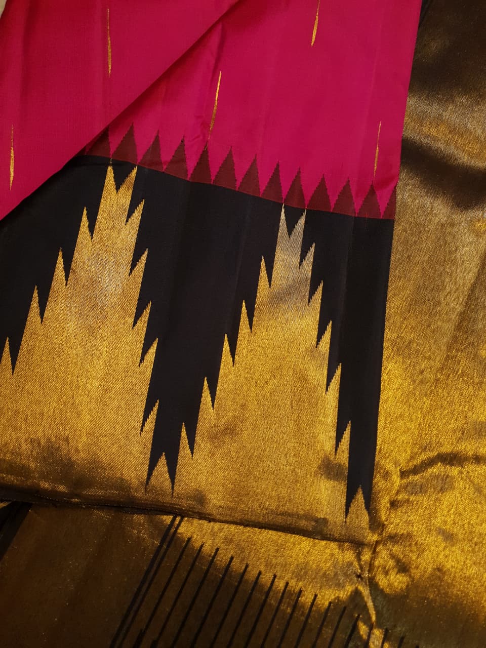Dark Pink Kanchipuram handloom korvai temple silk saree featuring black and gold zari temple borders, a rich gold zari pallu, and a certified silk mark weave.