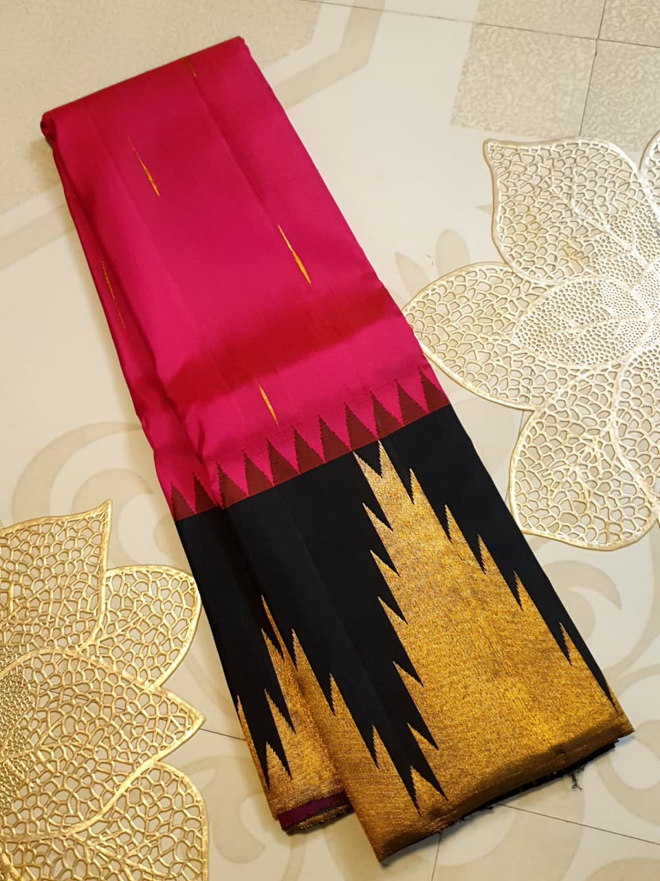 Dark Pink Kanchipuram handloom korvai temple silk saree featuring black and gold zari temple borders, a rich gold zari pallu, and a certified silk mark weave.