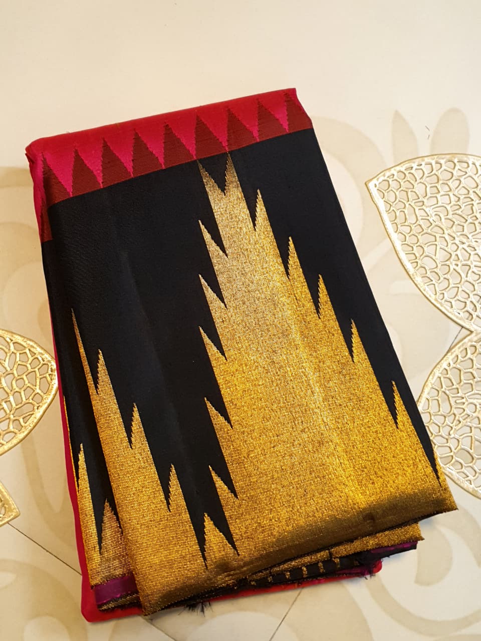 Dark Pink Kanchipuram handloom korvai temple silk saree featuring black and gold zari temple borders, a rich gold zari pallu, and a certified silk mark weave.