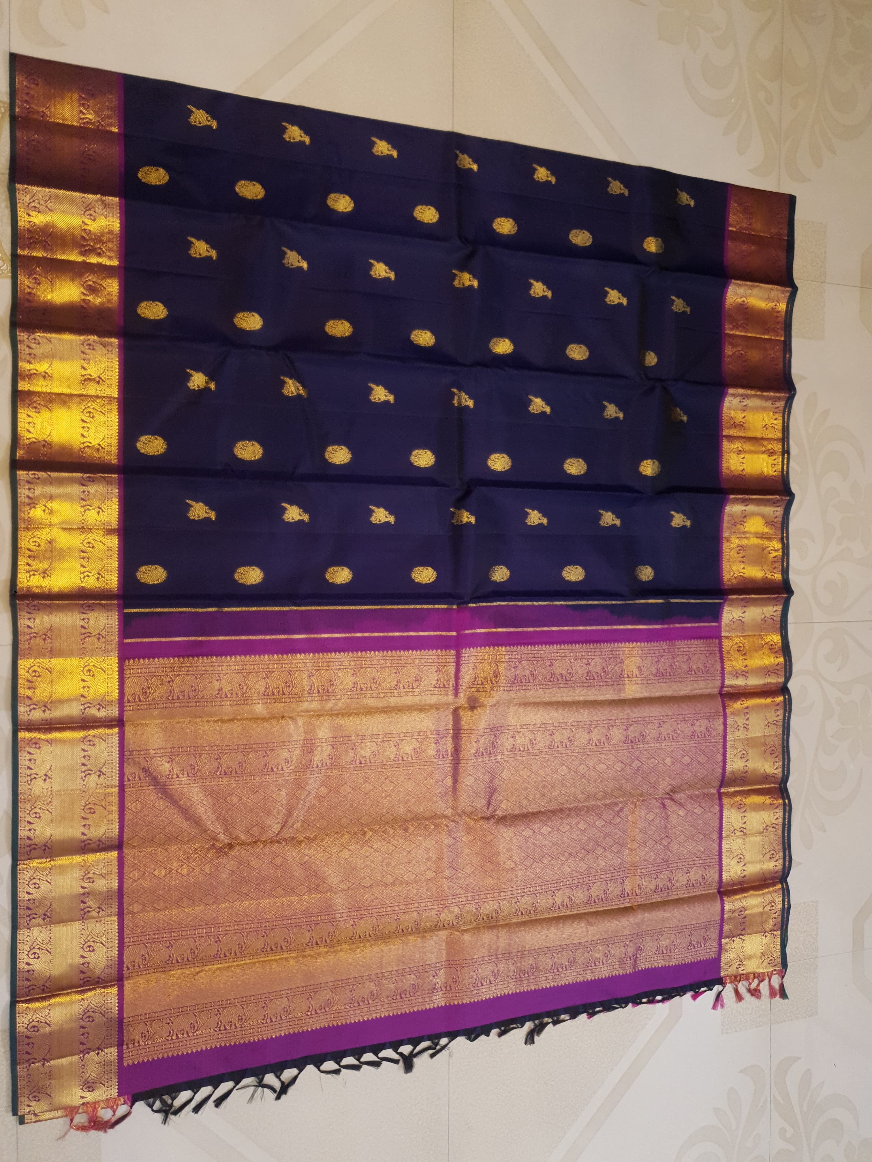 Purple Kanchipuram handloom pattu silk saree featuring intricate 2G gold motifs, a rich contrasting magenta pallu, matching magenta borders, and a certified silk mark wea