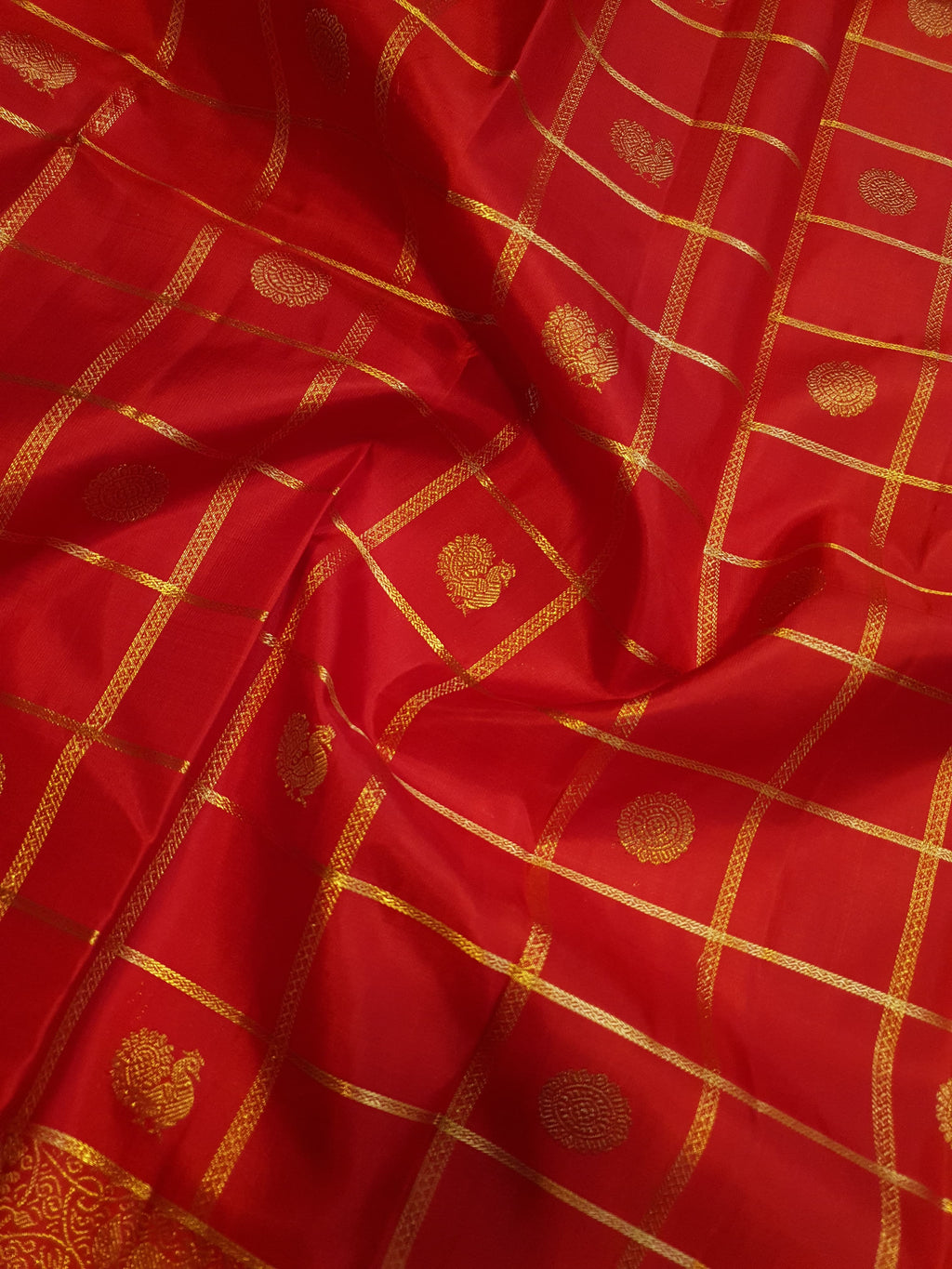 Chilly Red Kanchipuram Handloom 2G Gold Pattu Silk Saree with golden grid patterns, ornate animal-motif borders, and an opulent gold zari pallu.