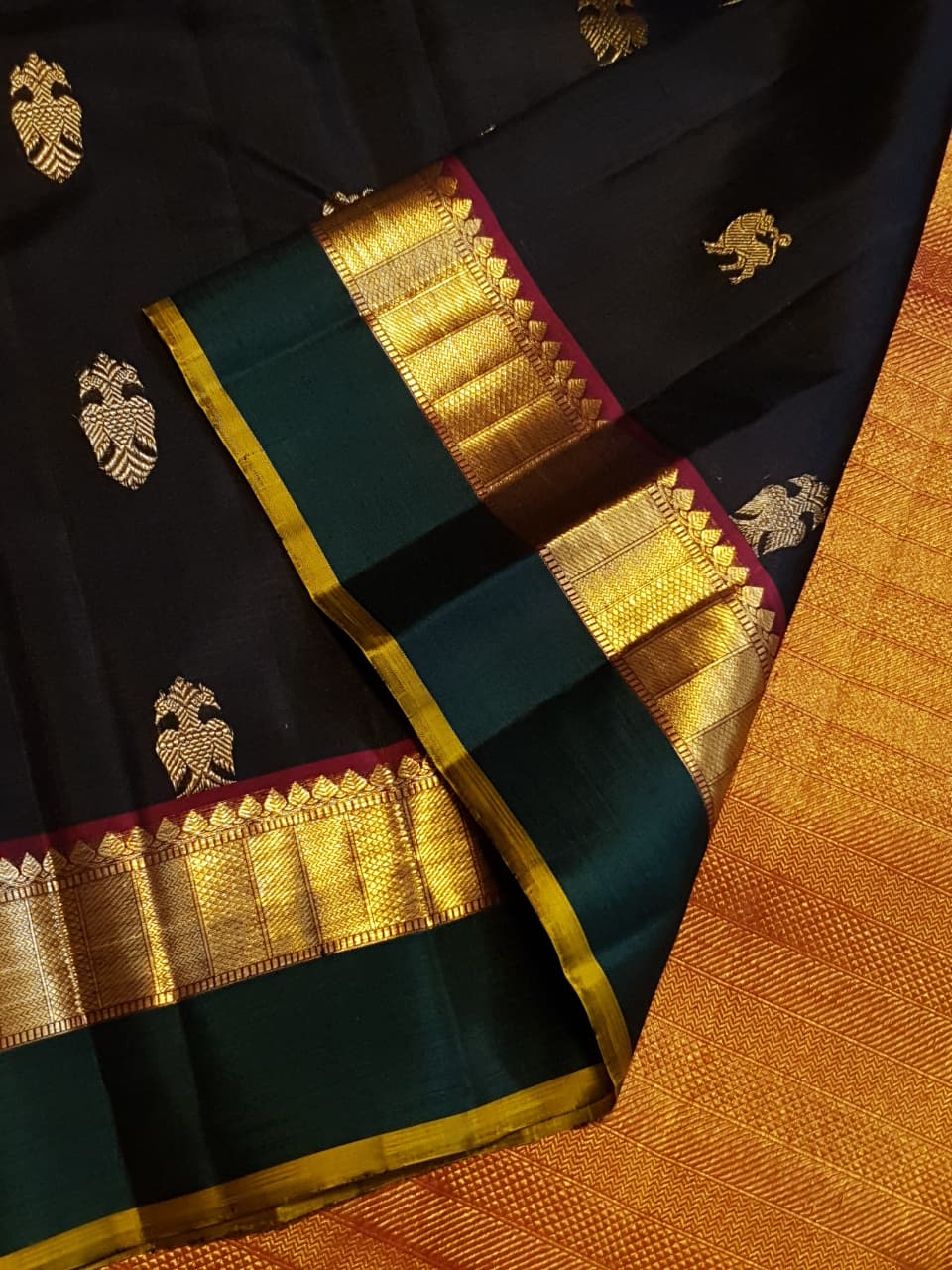 Darkest Purple Kanchipuram Handloom 2G Gold Pattu Silk Saree with Bottle Green and Red borders.
