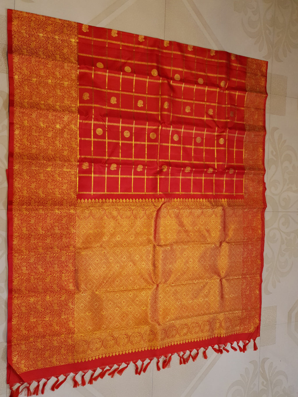 Chilly Red Kanchipuram Handloom 2G Gold Pattu Silk Saree with golden grid patterns, ornate animal-motif borders, and an opulent gold zari pallu.