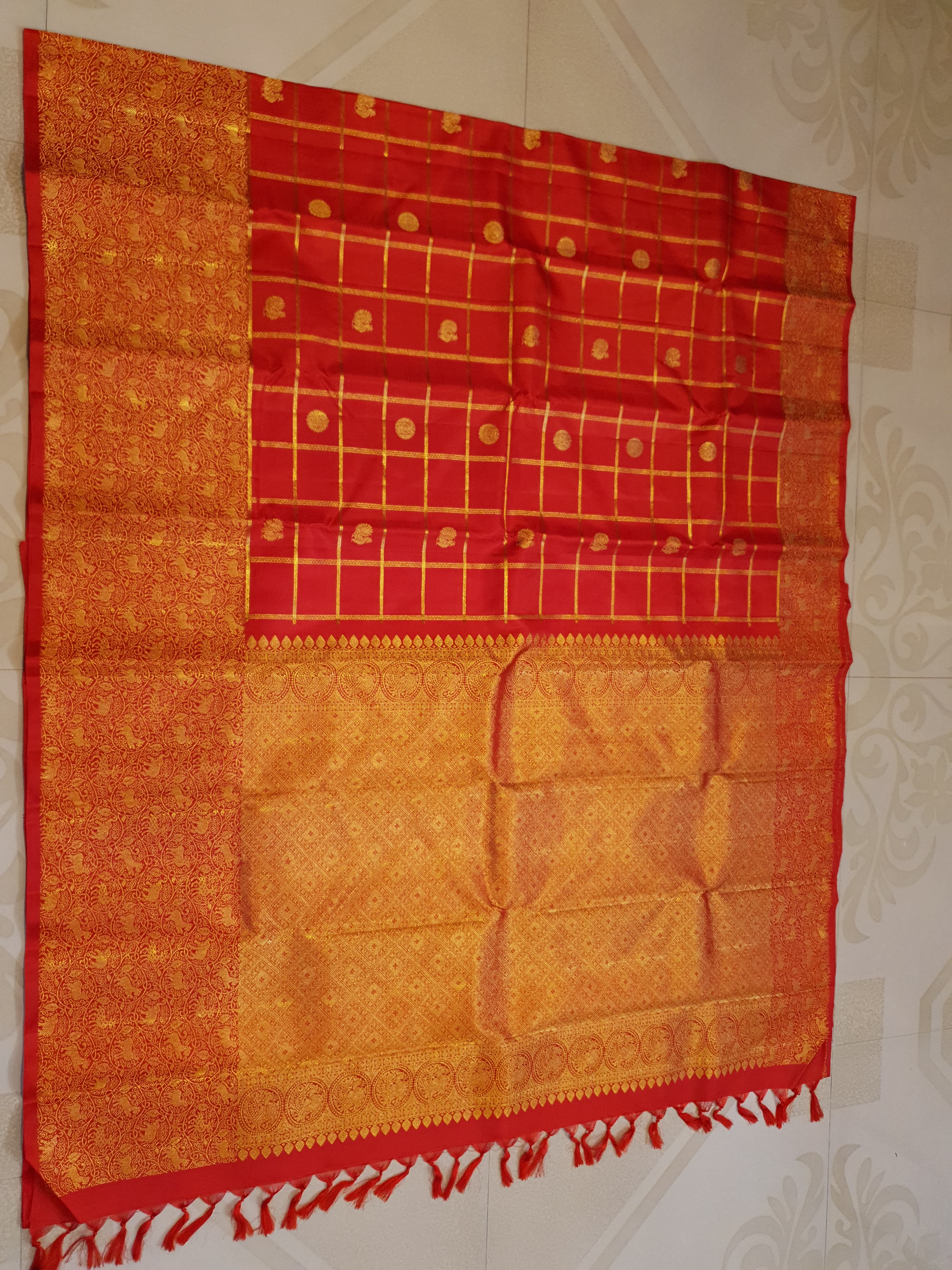 Chilly Red Kanchipuram Handloom 2G Gold Pattu Silk Saree with golden grid patterns, ornate animal-motif borders, and an opulent gold zari pallu.