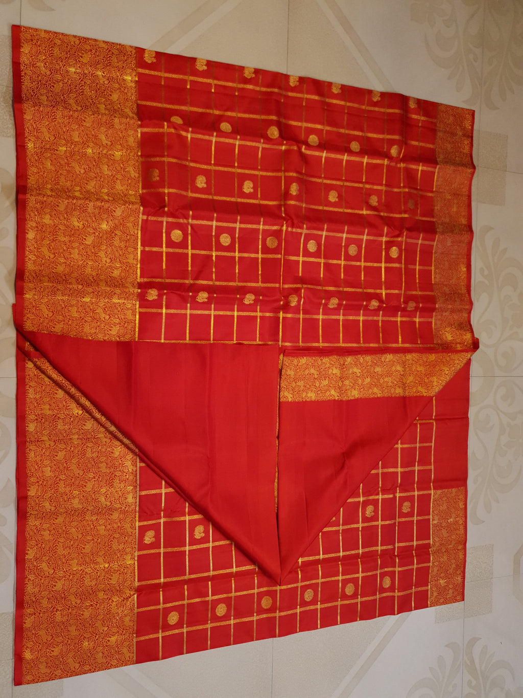 Chilly Red Kanchipuram Handloom 2G Gold Pattu Silk Saree with golden grid patterns, ornate animal-motif borders, and an opulent gold zari pallu.