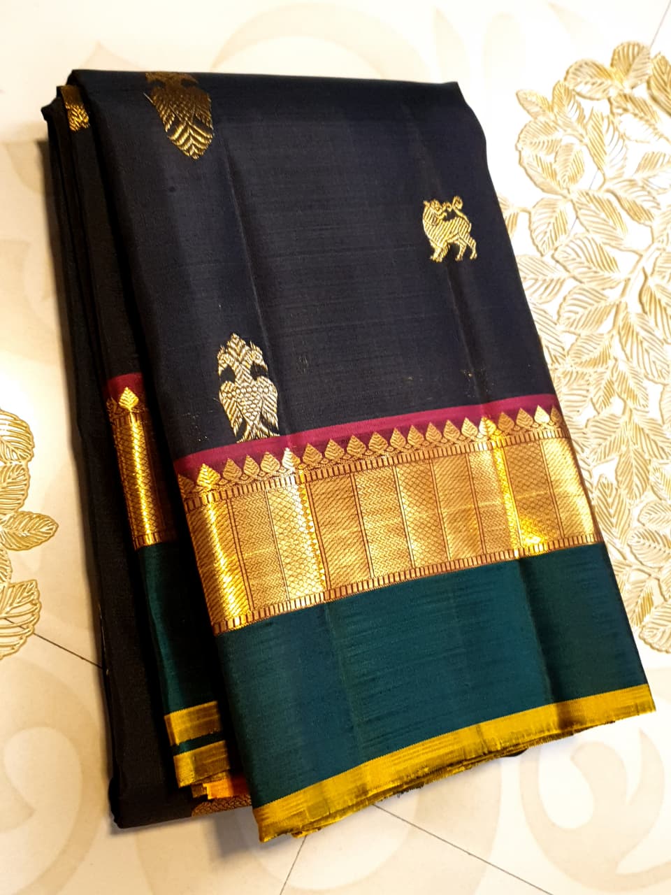 Darkest Purple Kanchipuram Handloom 2G Gold Pattu Silk Saree with Bottle Green and Red borders.