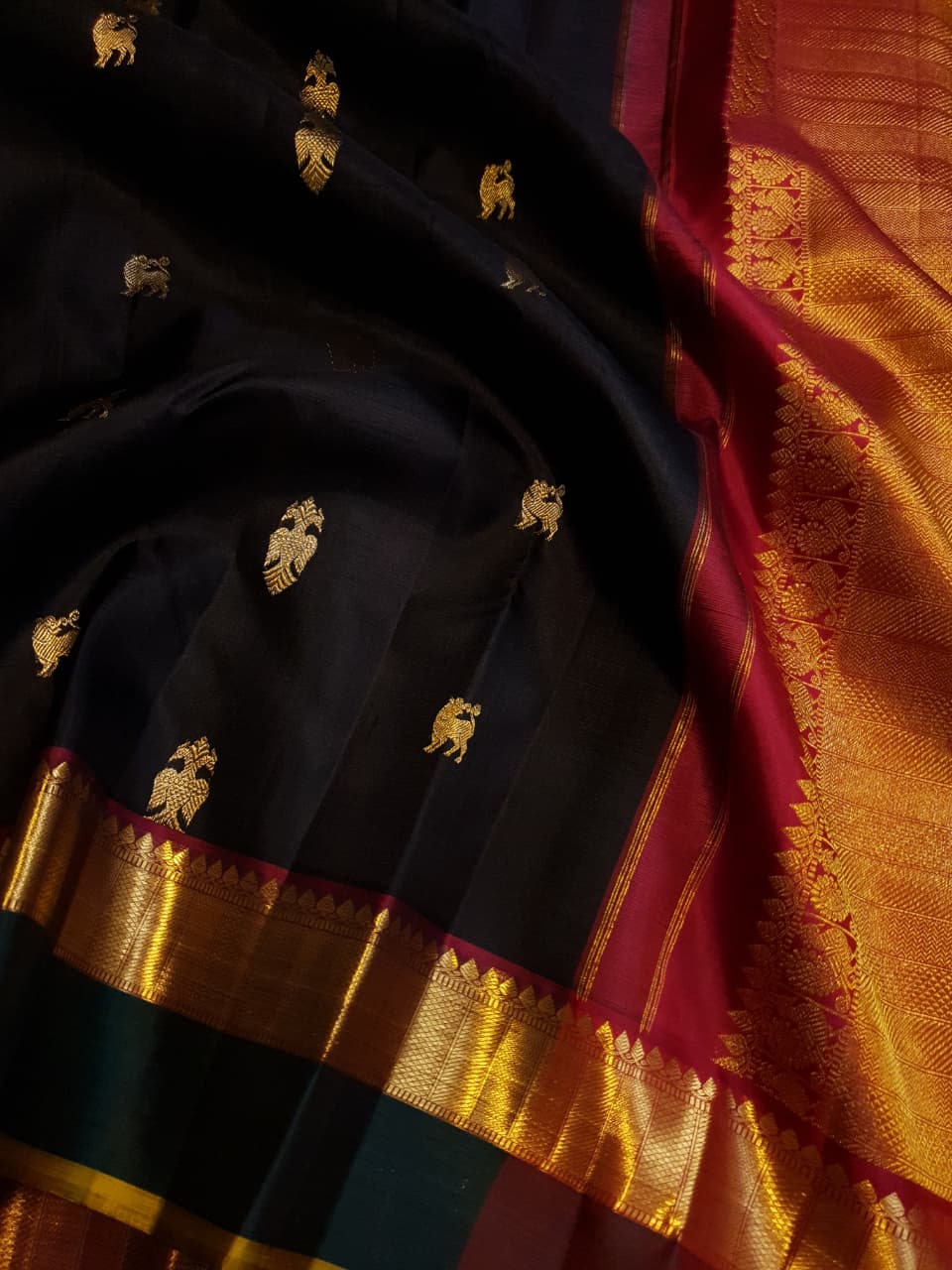 Darkest Purple Kanchipuram Handloom 2G Gold Pattu Silk Saree with Bottle Green and Red borders.