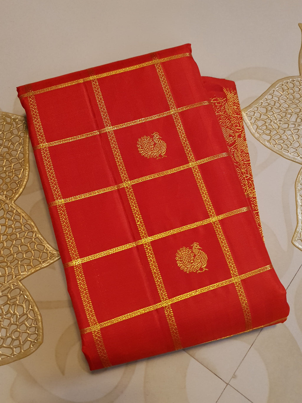 Chilly Red Kanchipuram Handloom 2G Gold Pattu Silk Saree with golden grid patterns, ornate animal-motif borders, and an opulent gold zari pallu.