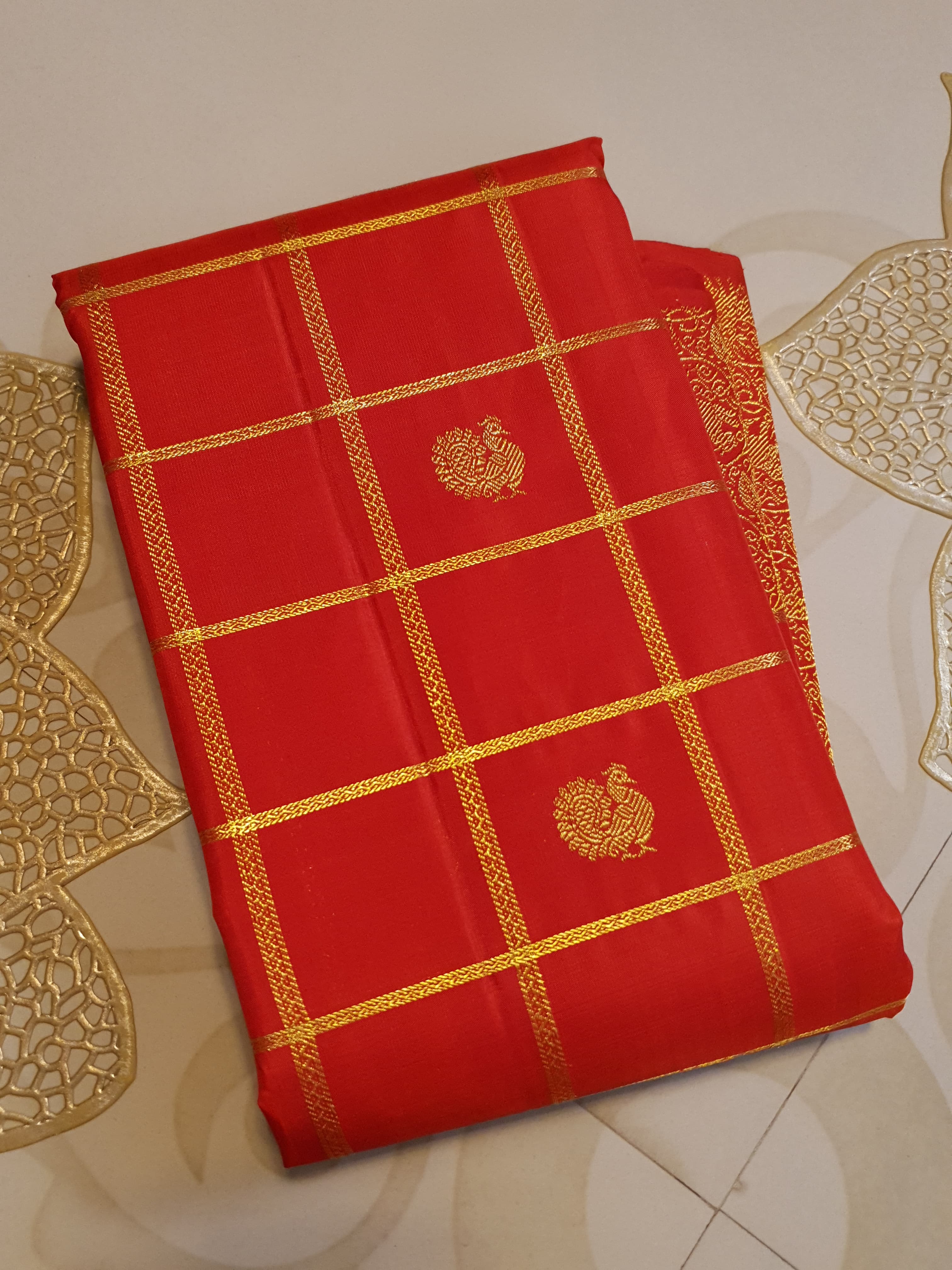 Chilly Red Kanchipuram Handloom 2G Gold Pattu Silk Saree with golden grid patterns, ornate animal-motif borders, and an opulent gold zari pallu.