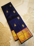 Purple Kanchipuram handloom pattu silk saree featuring intricate 2G gold motifs, a rich contrasting magenta pallu, matching magenta borders, and a certified silk mark wea