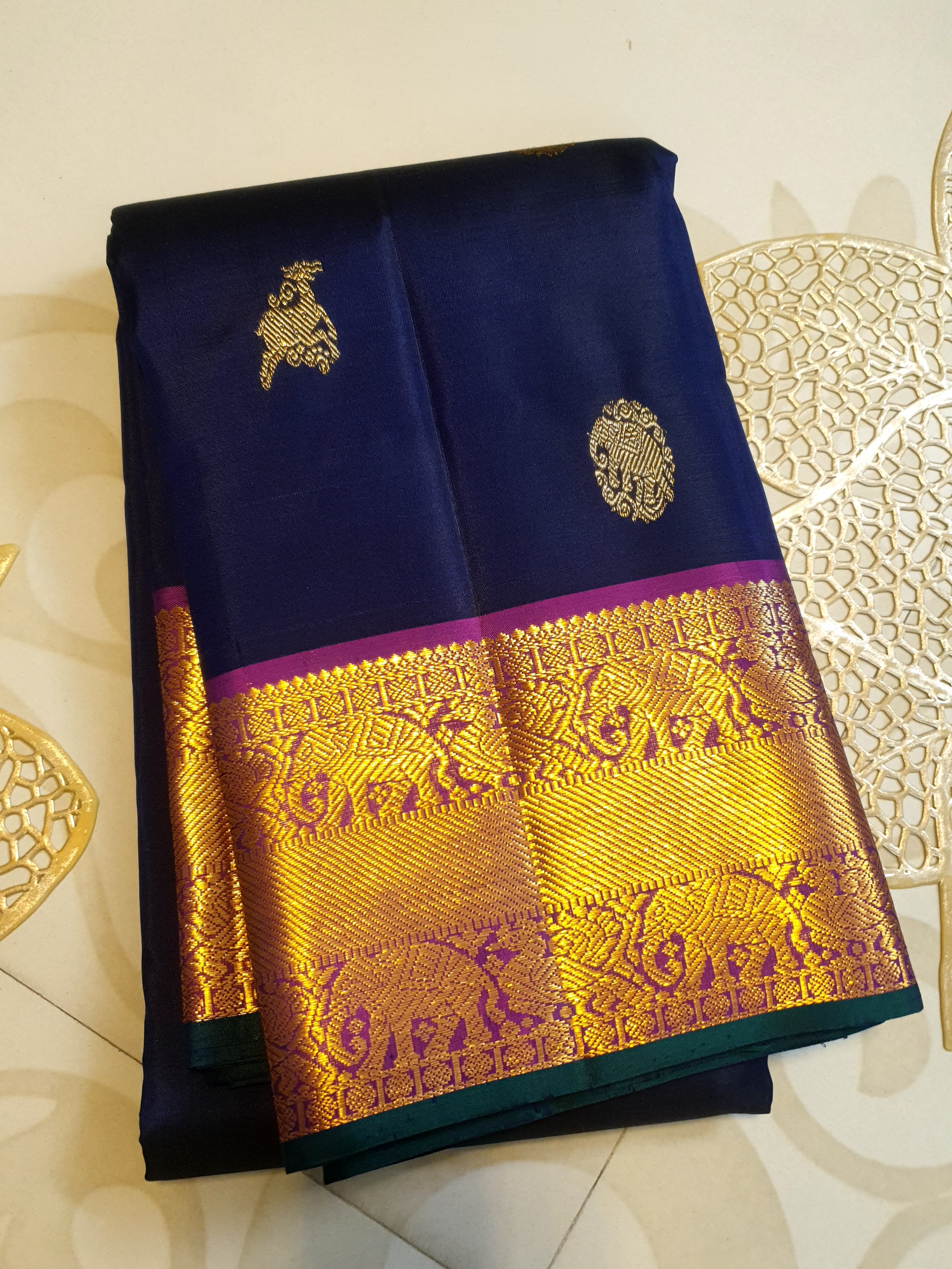 Purple Kanchipuram handloom pattu silk saree featuring intricate 2G gold motifs, a rich contrasting magenta pallu, matching magenta borders, and a certified silk mark wea