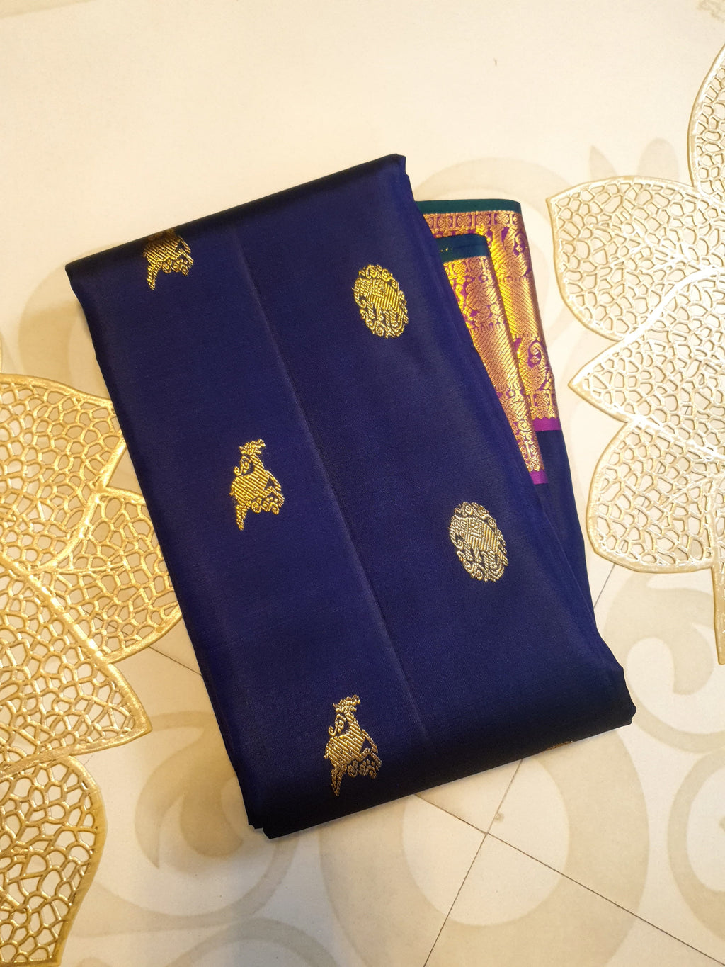 Purple Kanchipuram handloom pattu silk saree featuring intricate 2G gold motifs, a rich contrasting magenta pallu, matching magenta borders, and a certified silk mark wea