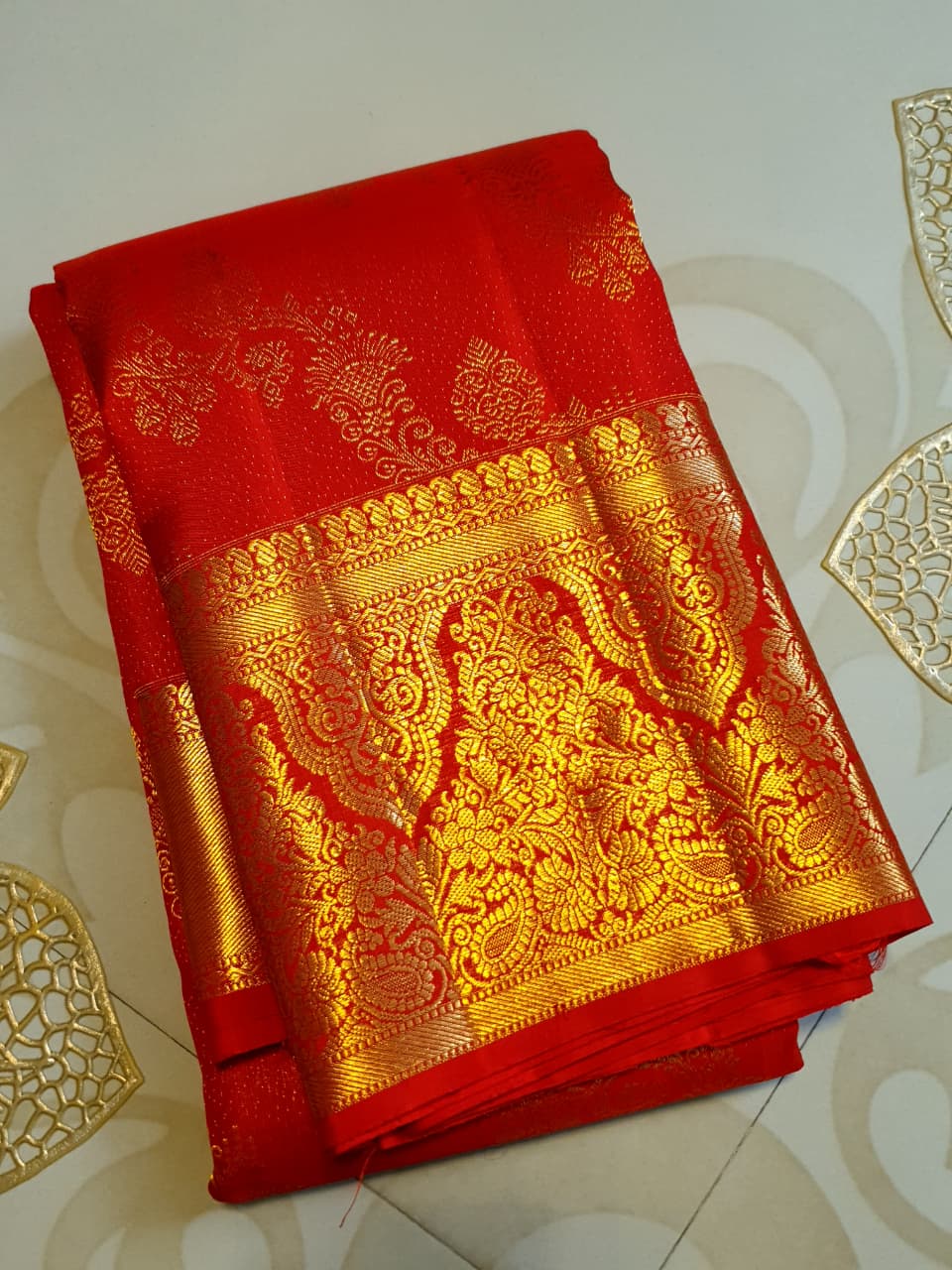 Chilly Red Kanchipuram Handloom 2G Gold Pattu Silk Saree with intricate floral brocade and a rich gold border.