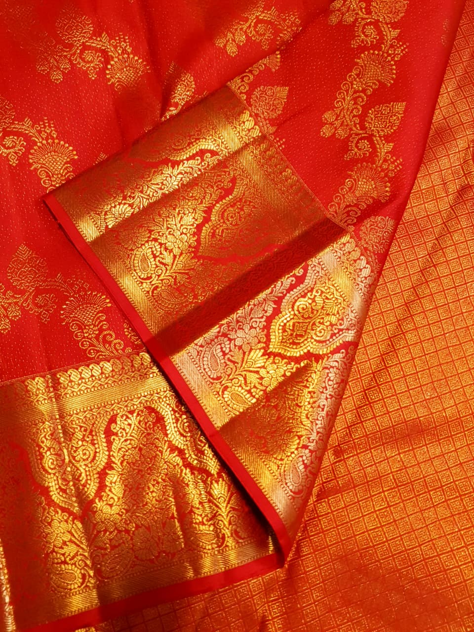 Chilly Red Kanchipuram Handloom 2G Gold Pattu Silk Saree with intricate floral brocade and a rich gold border.