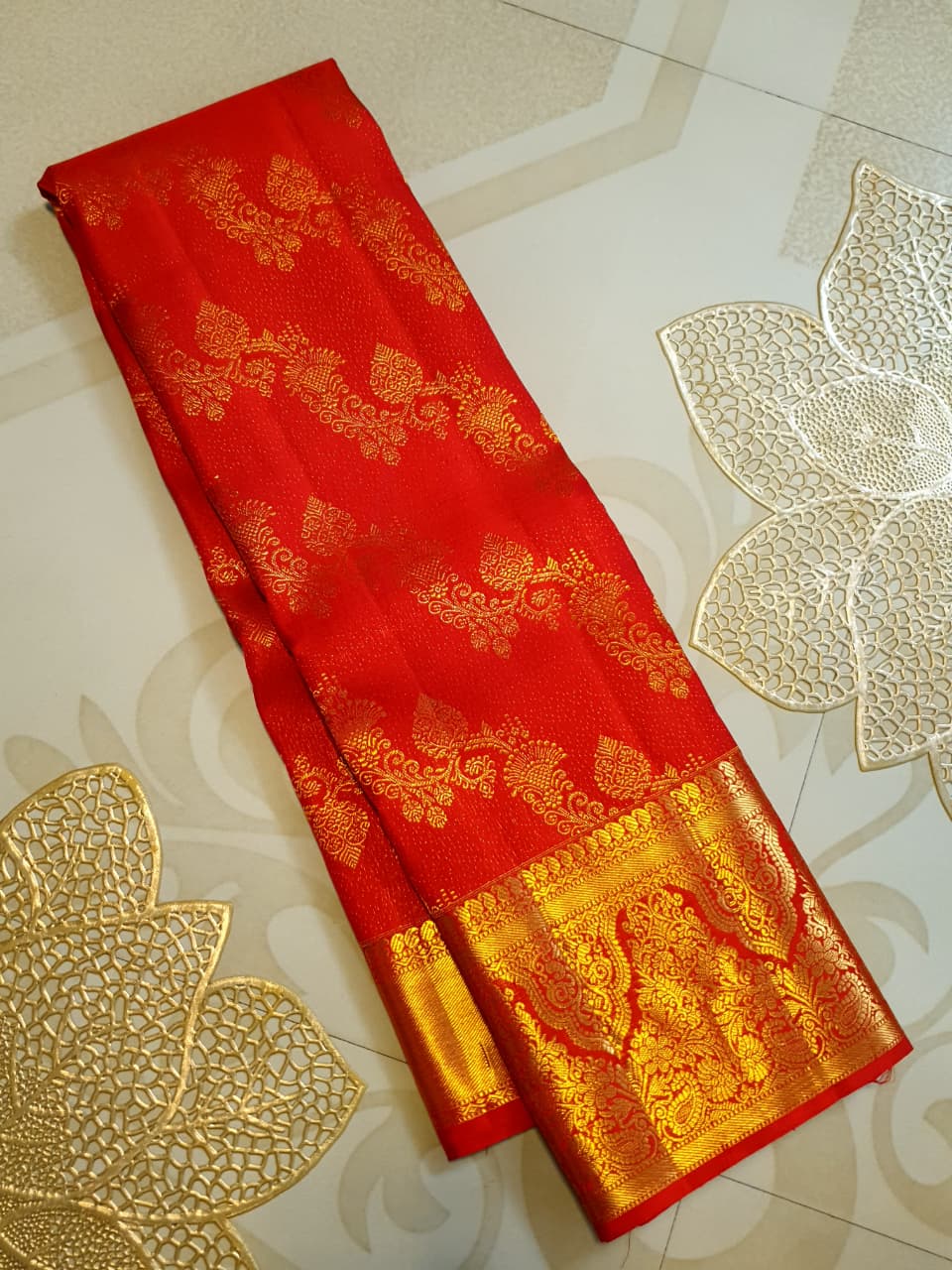 Chilly Red Kanchipuram Handloom 2G Gold Pattu Silk Saree with intricate floral brocade and a rich gold border.