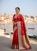 Exquisite Rustic Red Banarasi Katan Silk Saree featuring the legendary Kashi Ghat Meenakari design. Silk Mark Certified for 100% purity. A masterpiece of handloom storytelling.