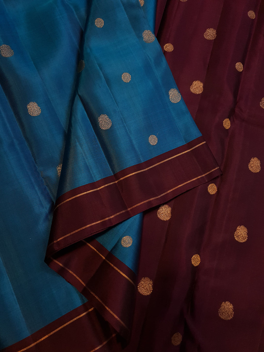 Peacock Blue Kanchipuram handloom silk saree, featuring a deep maroon border and intricate 3G pure gold zari work.