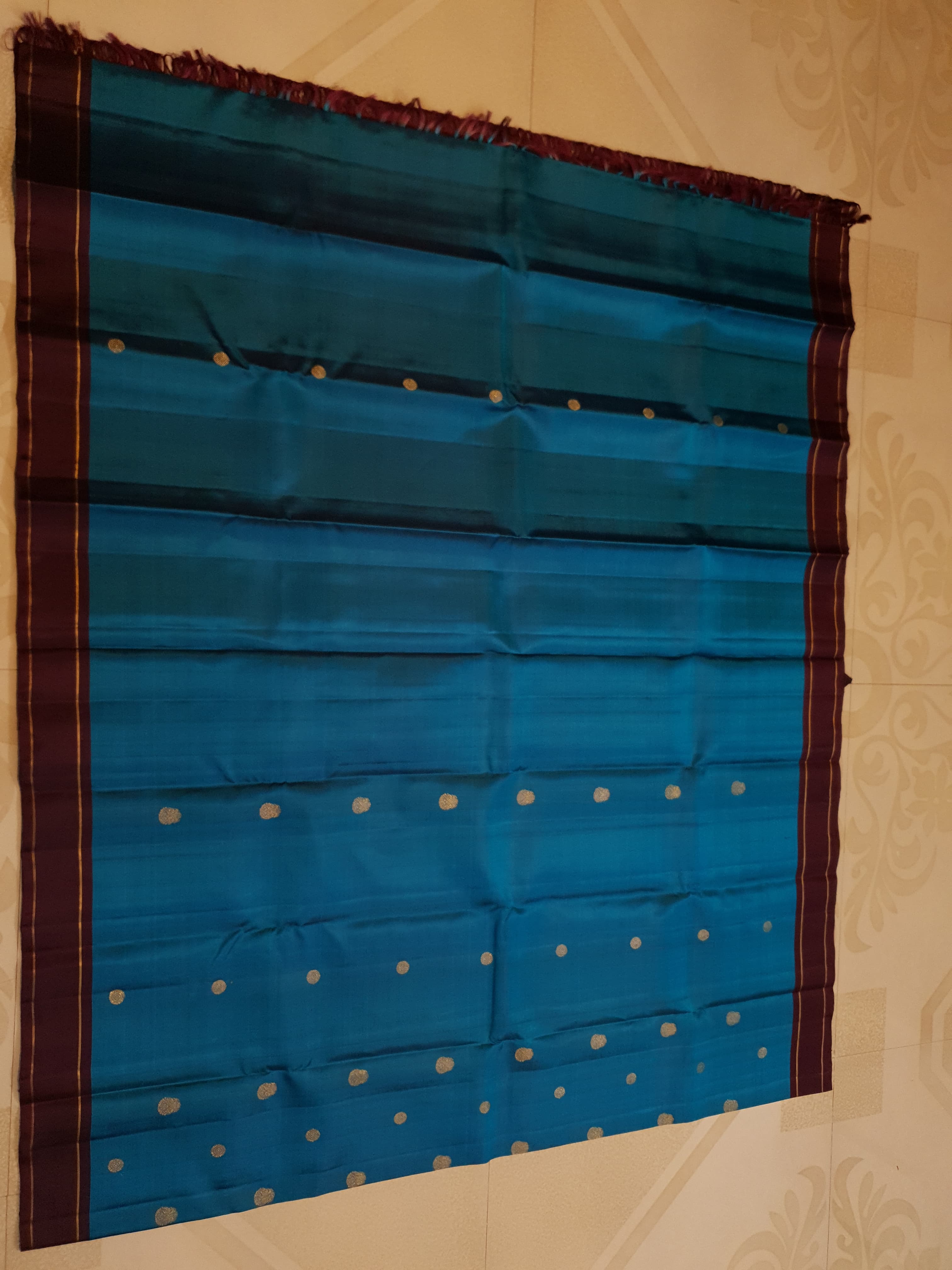 Peacock Blue Kanchipuram handloom silk saree, featuring a deep maroon border and intricate 3G pure gold zari work.
