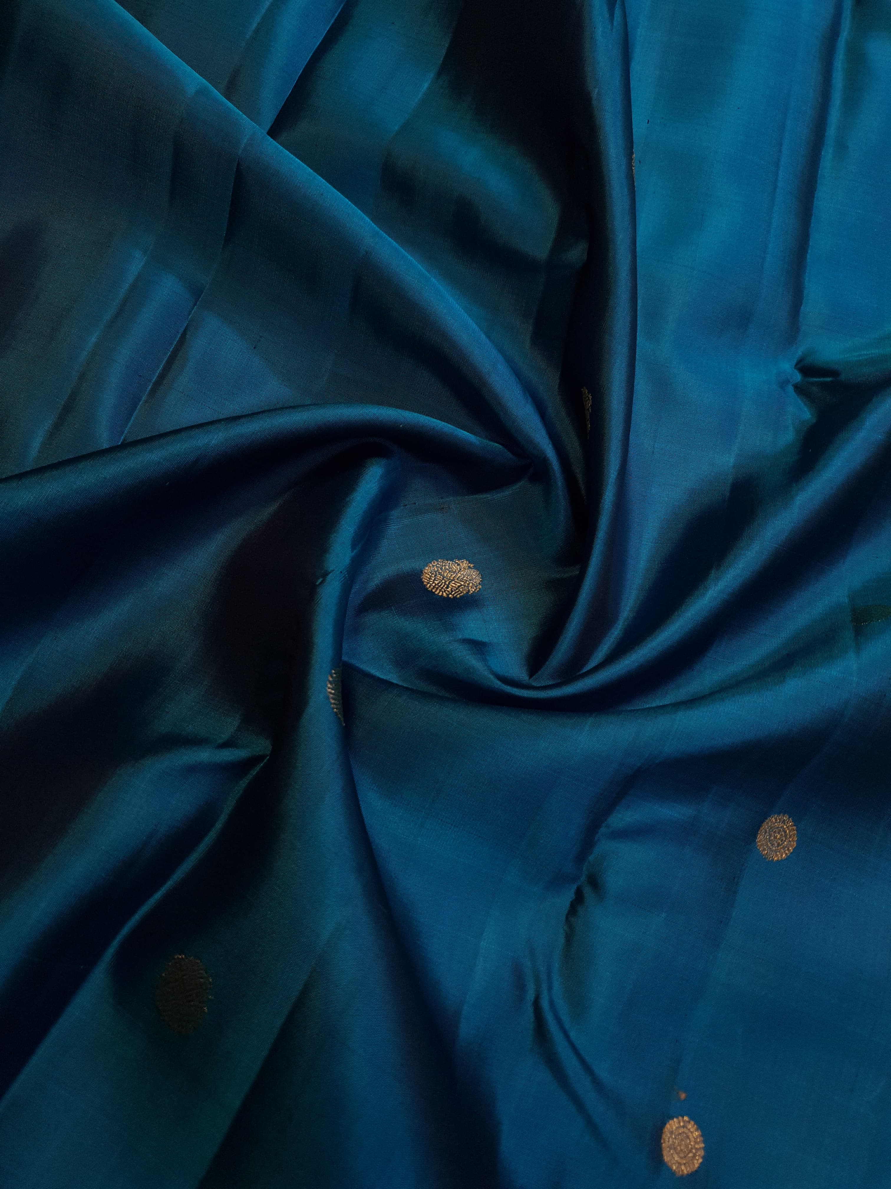 Peacock Blue Kanchipuram handloom silk saree, featuring a deep maroon border and intricate 3G pure gold zari work.