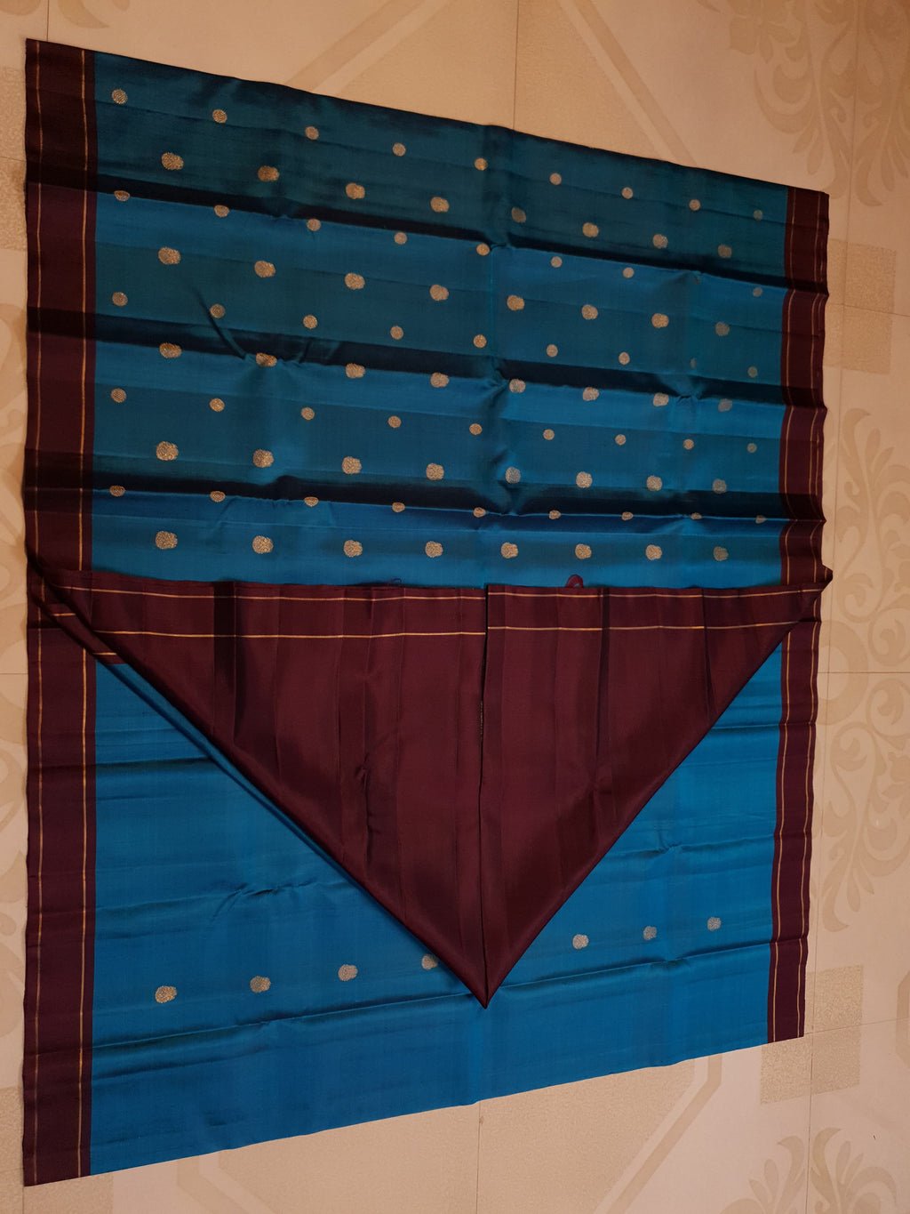 Peacock Blue Kanchipuram handloom silk saree, featuring a deep maroon border and intricate 3G pure gold zari work.