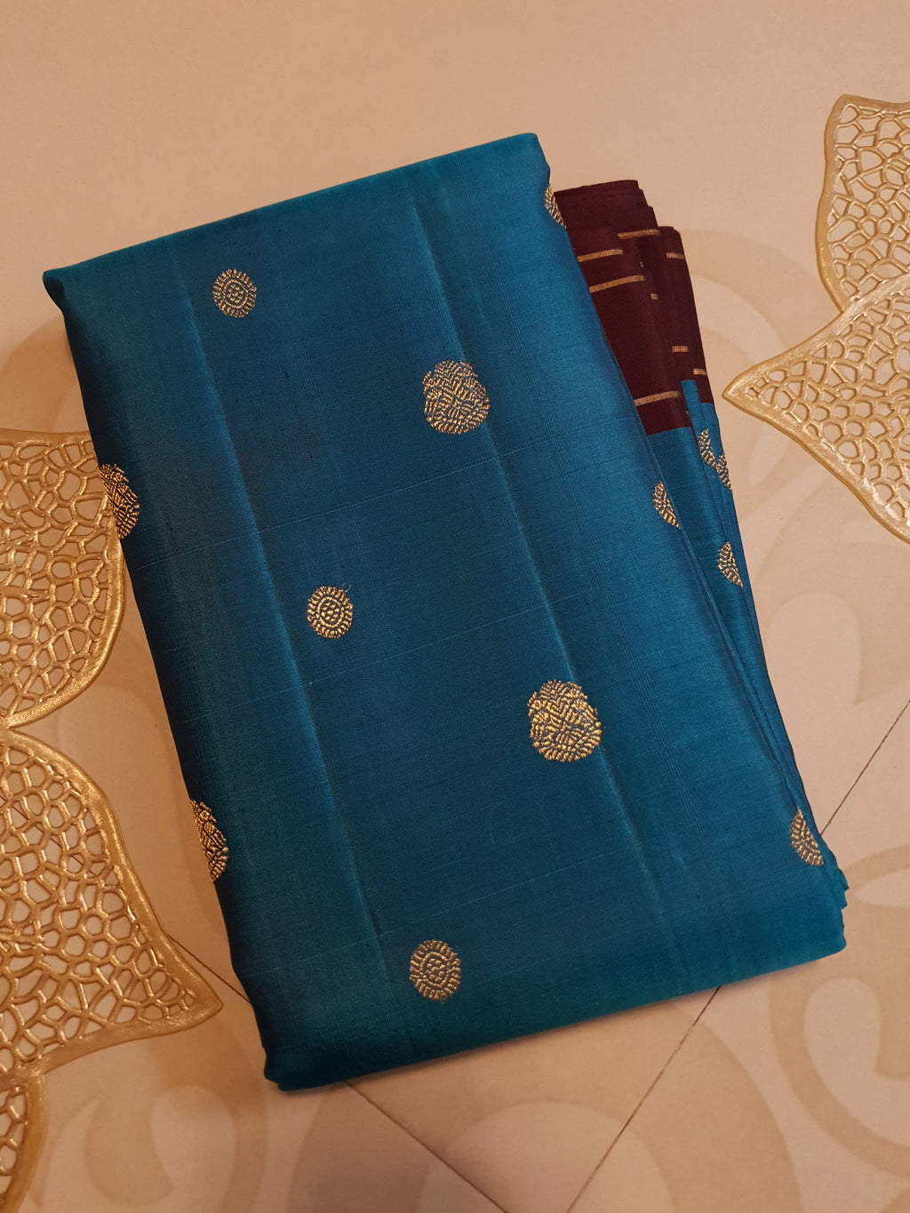 Peacock Blue Kanchipuram handloom silk saree, featuring a deep maroon border and intricate 3G pure gold zari work.