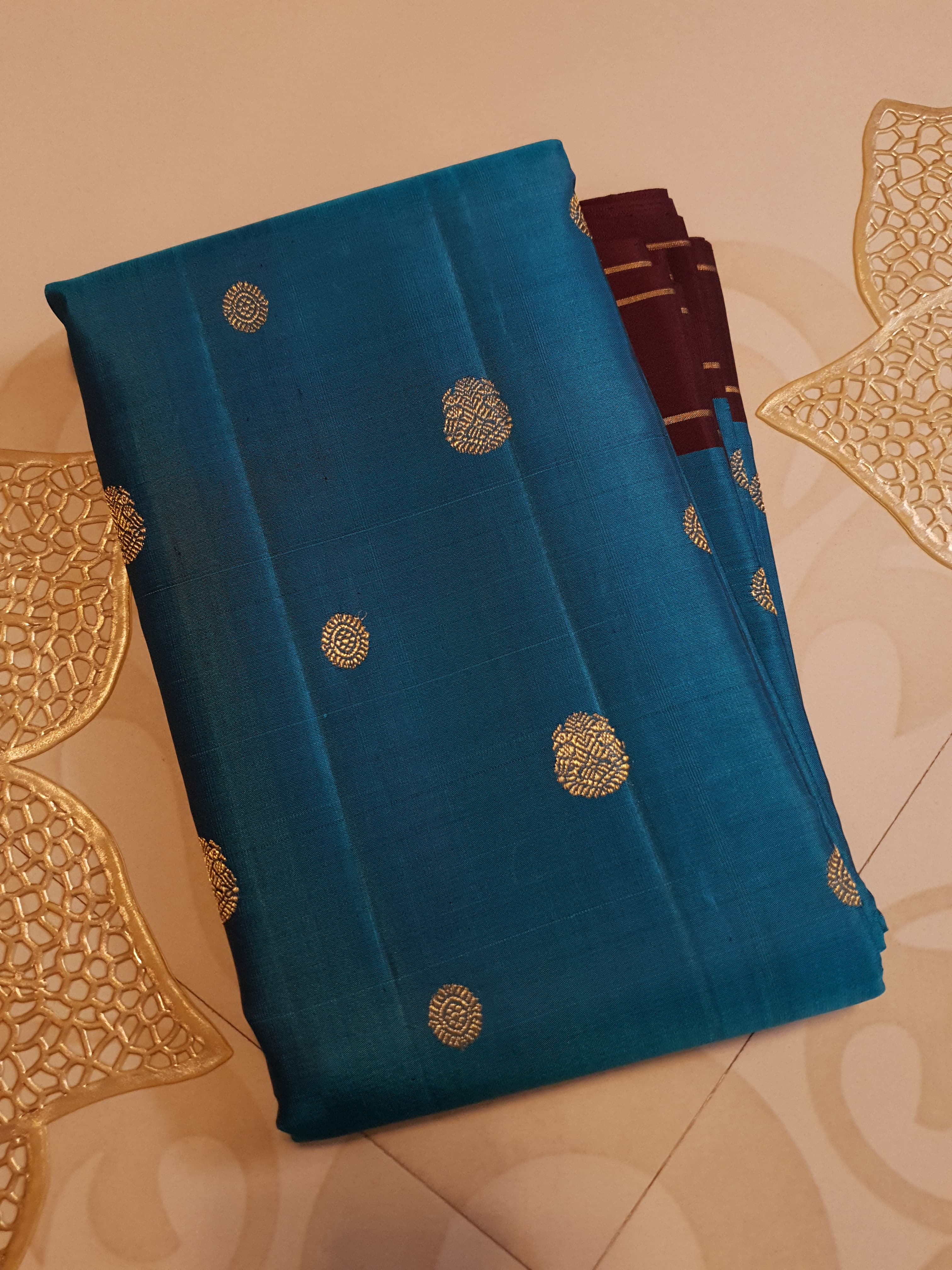 Peacock Blue Kanchipuram handloom silk saree, featuring a deep maroon border and intricate 3G pure gold zari work.