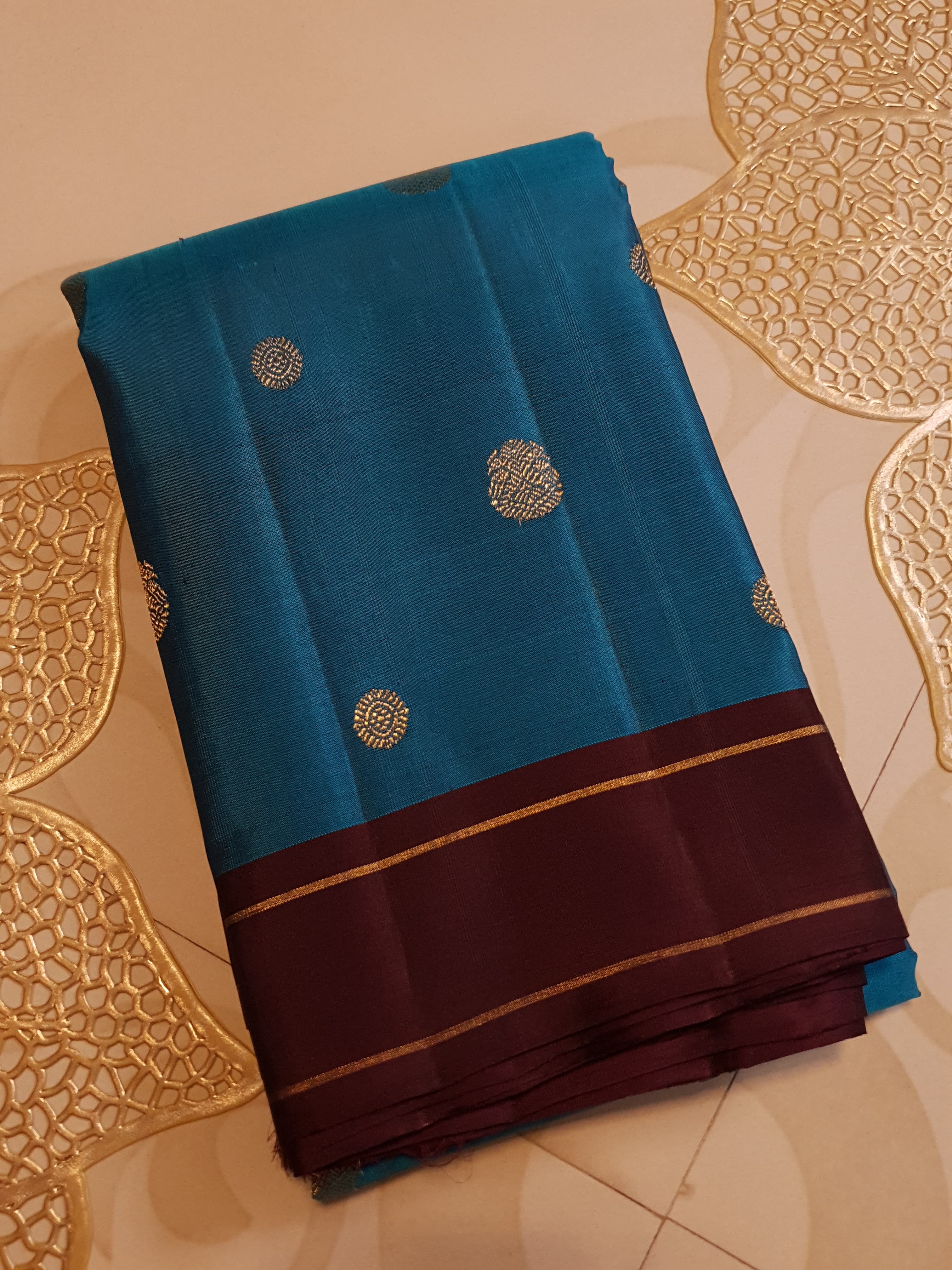 Peacock Blue Kanchipuram handloom silk saree, featuring a deep maroon border and intricate 3G pure gold zari work.