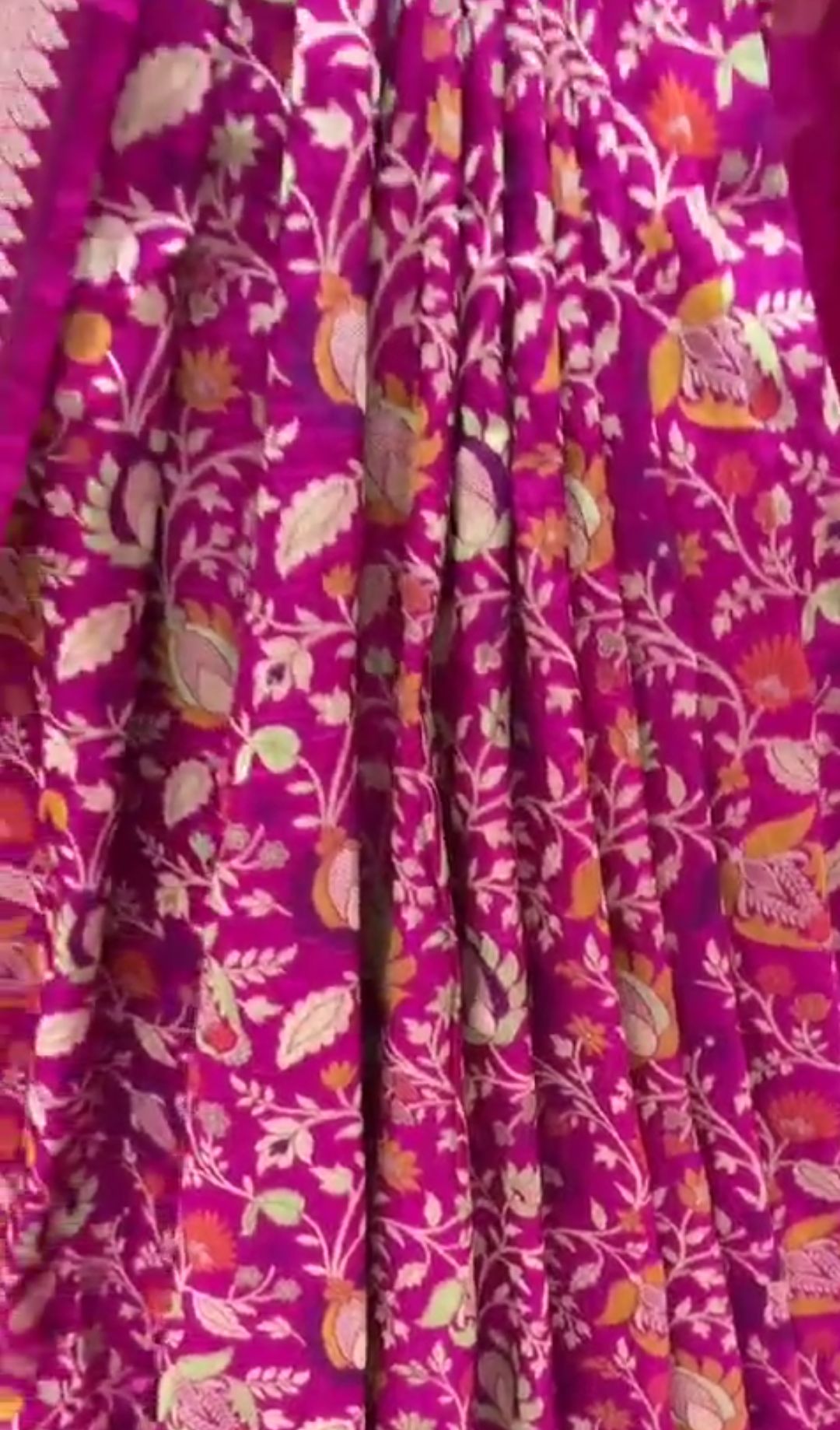 Royal hot pink Katan silk saree with vibrant three-colored Tilfi Meenakari floral buttas and a rich gold zari border.