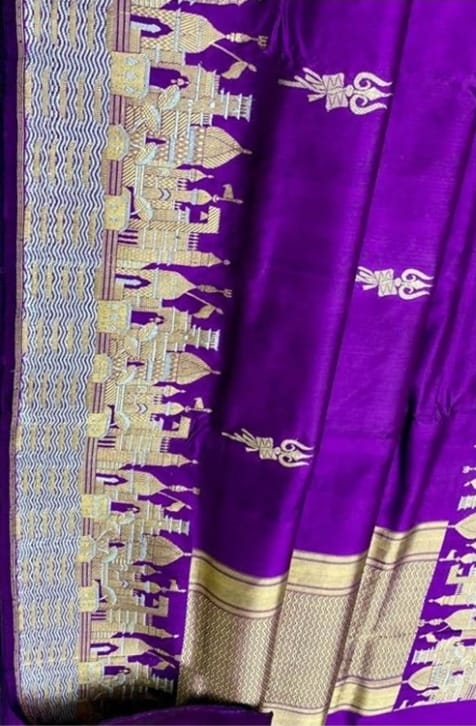 Royal purple Katan silk saree featuring gold zari Damru and Trishul motifs on the body and an intricate Kashi Ghat temple border.
