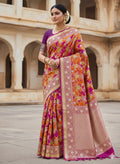 A vibrant hot pink Banarasi Katan silk saree featuring hand-woven Rangkaat diagonal color blocks and intricate Meenakari floral vines in shimmering gold zari.