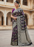 A majestic black Banarasi Katan silk saree featuring hand-woven Rangkaat diagonal color blocks and intricate Meenakari floral vines in shimmering gold zari.