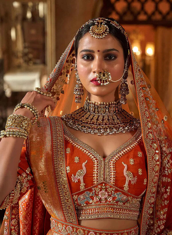 Designer Orange Lehenga Choli with Heavy Embroidery & Pearls