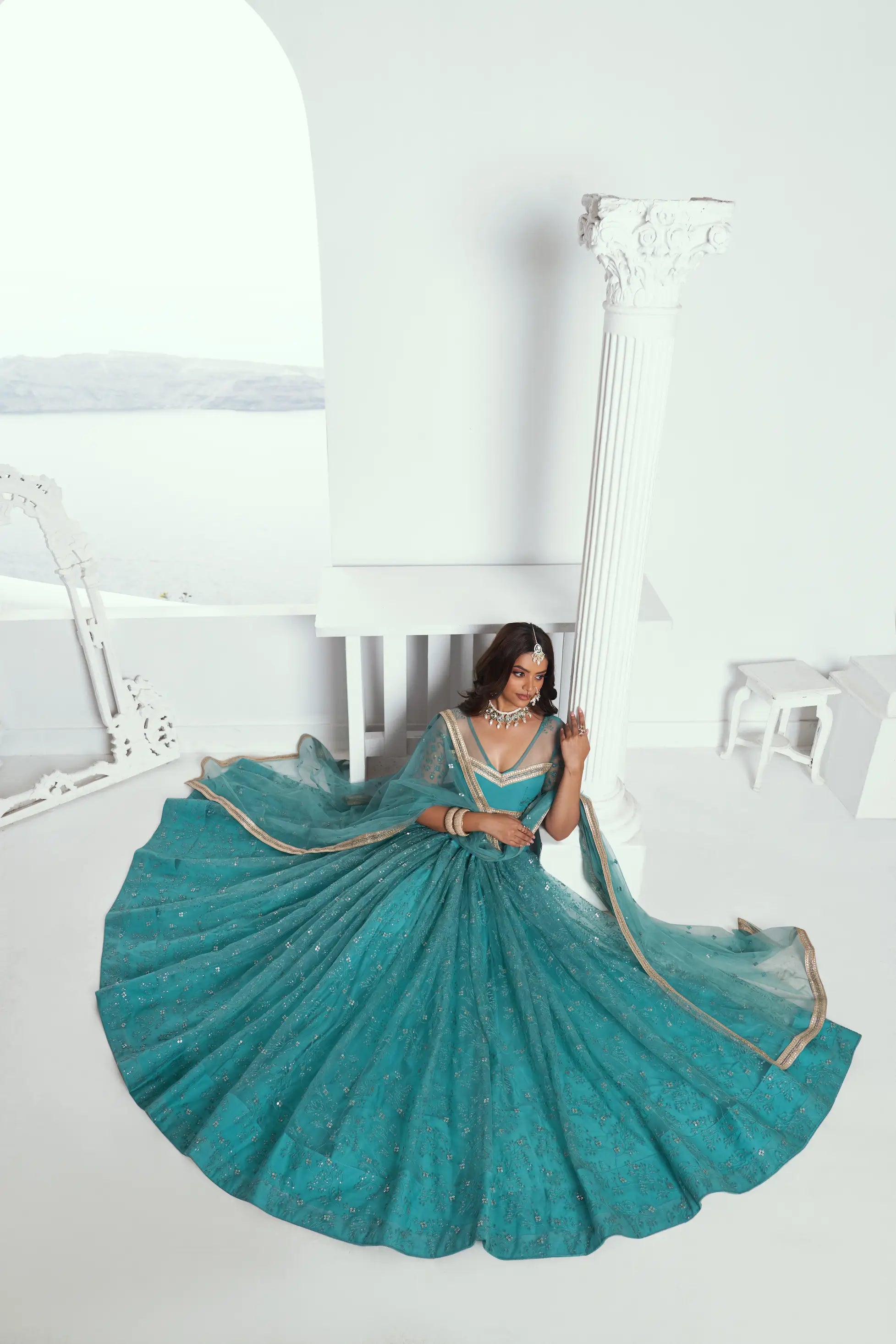 Fountain Blue Sequins Embroidered Net Lehenga Choli
