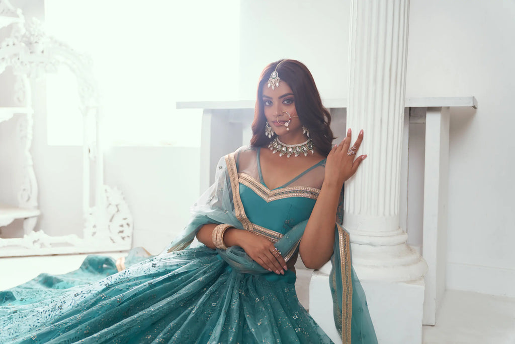 Fountain Blue Sequins Embroidered Net Lehenga Choli