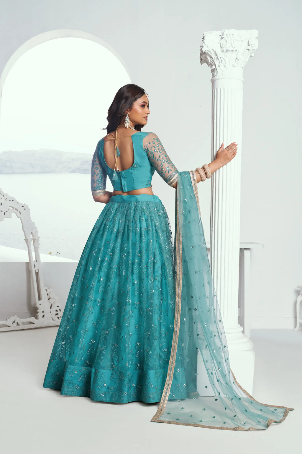Fountain Blue Sequins Embroidered Net Lehenga Choli