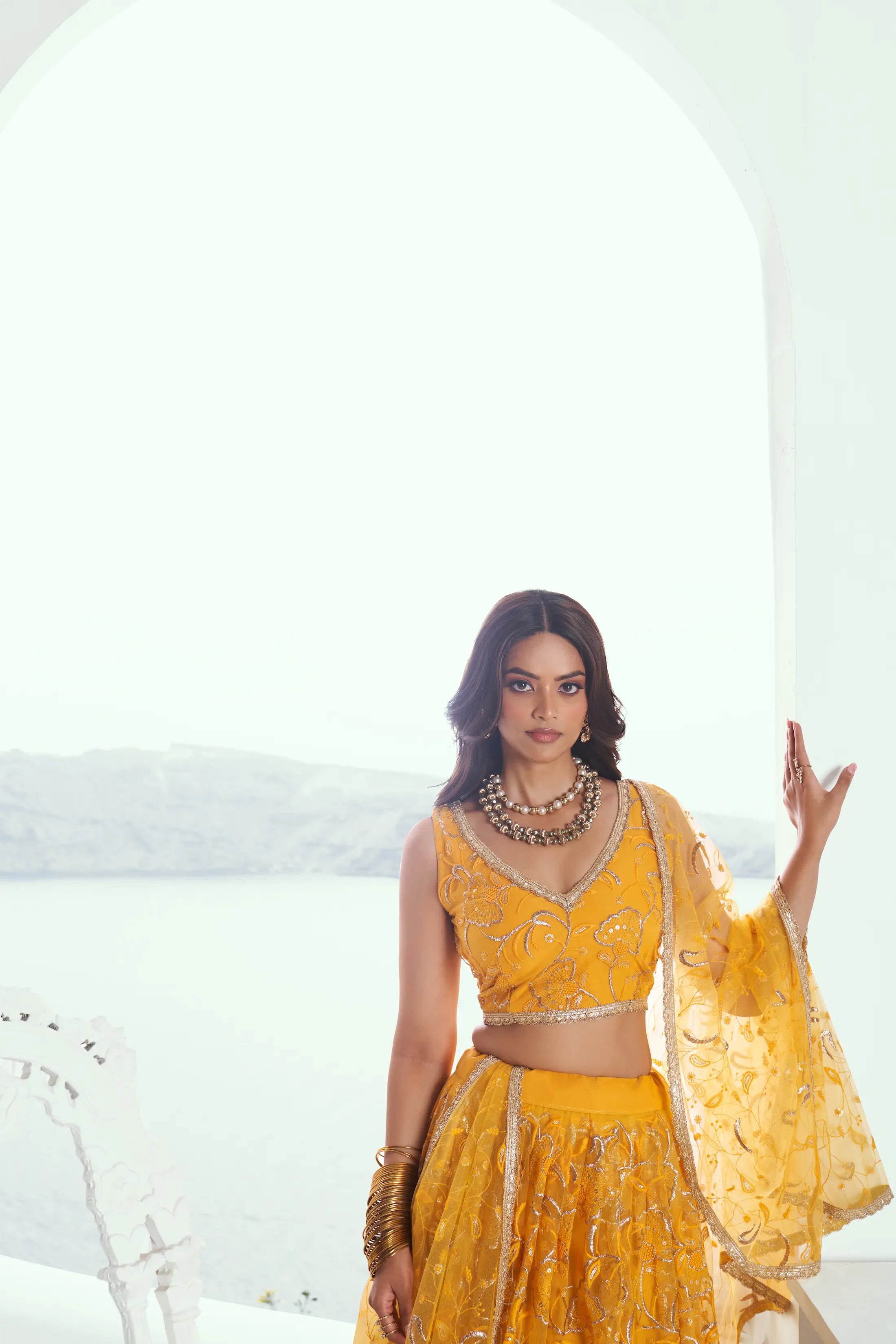 Dark Yellow Sequins Embroidered Net Lehenga Choli