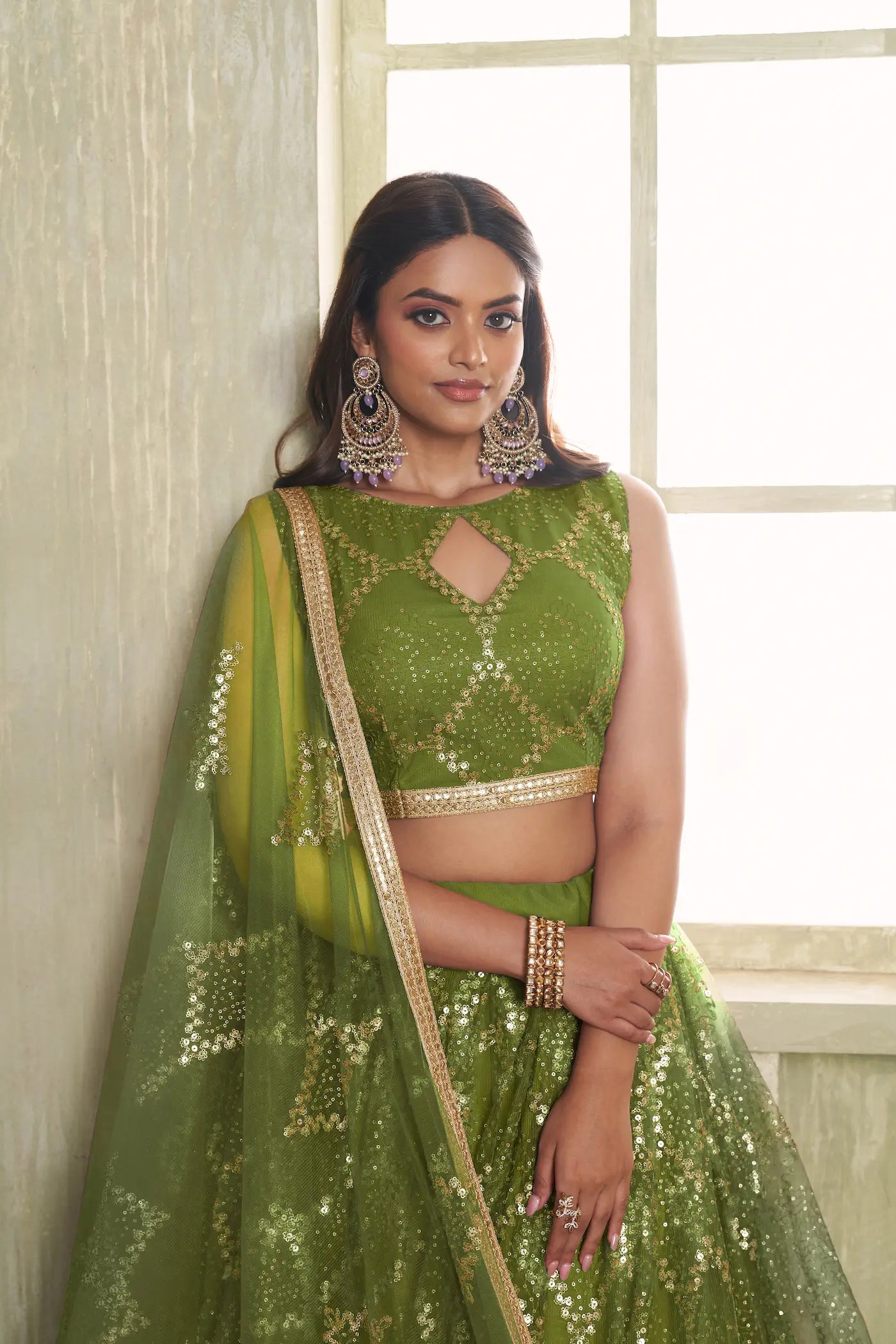 Leaf Green Net Lehenga Choli With Sequins Work