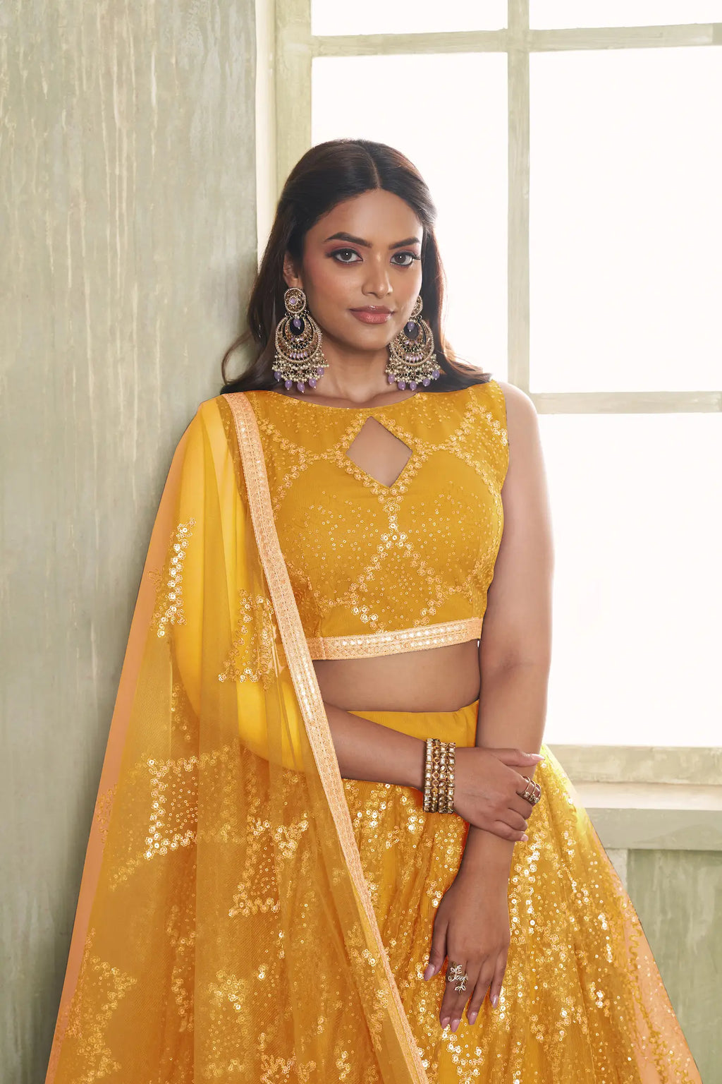Yellow Net Lehenga Choli With Sequins Work