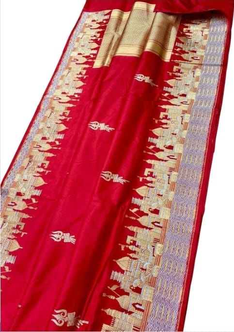 Exquisite Rustic Red Banarasi Katan Silk Saree featuring the legendary Kashi Ghat Meenakari design. Silk Mark Certified for 100% purity. A masterpiece of handloom storytelling.
