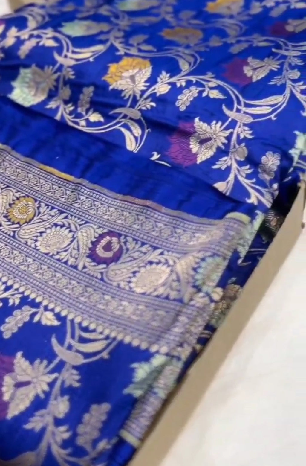 Azure Blue Handloom Banarasi Katan Silk Saree with Colorful Meenakari Floral Borders and Silk Mark Authenticity Label.