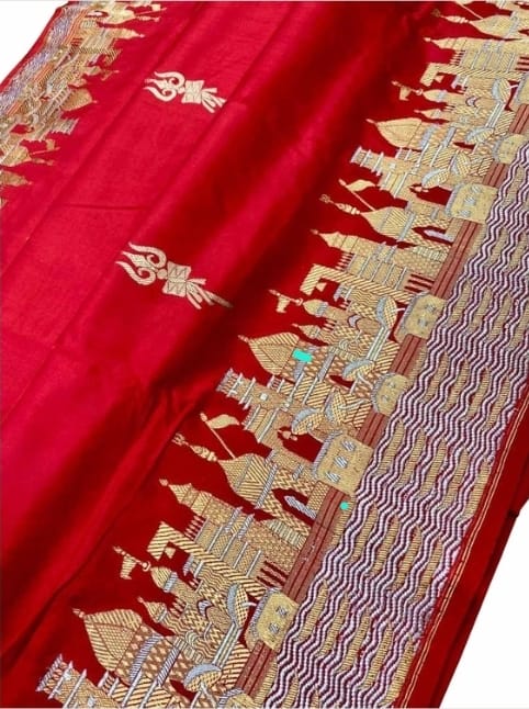 Exquisite Rustic Red Banarasi Katan Silk Saree featuring the legendary Kashi Ghat Meenakari design. Silk Mark Certified for 100% purity. A masterpiece of handloom storytelling.