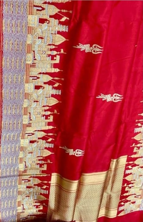 Exquisite Rustic Red Banarasi Katan Silk Saree featuring the legendary Kashi Ghat Meenakari design. Silk Mark Certified for 100% purity. A masterpiece of handloom storytelling.
