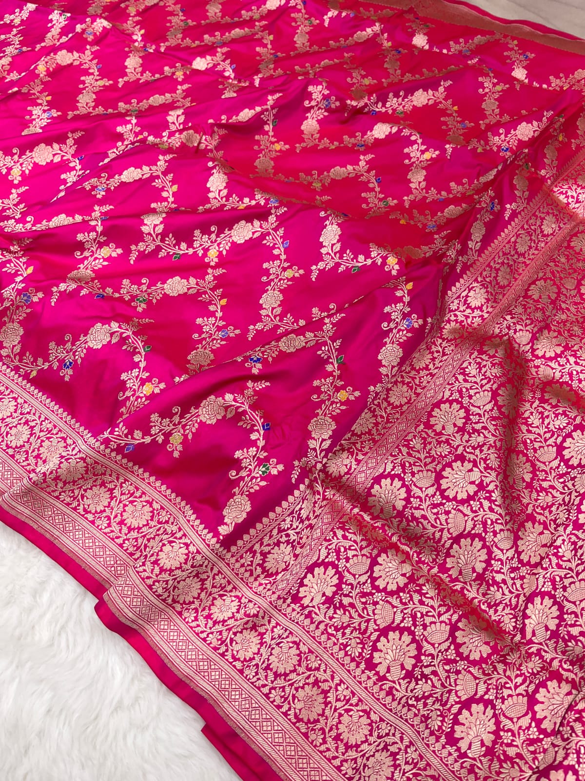 Rani pink Banarasi handloom pure Katan silk Kaduwa Jangla Meenakari saree featuring intricate gold zari and multi-color floral motifs