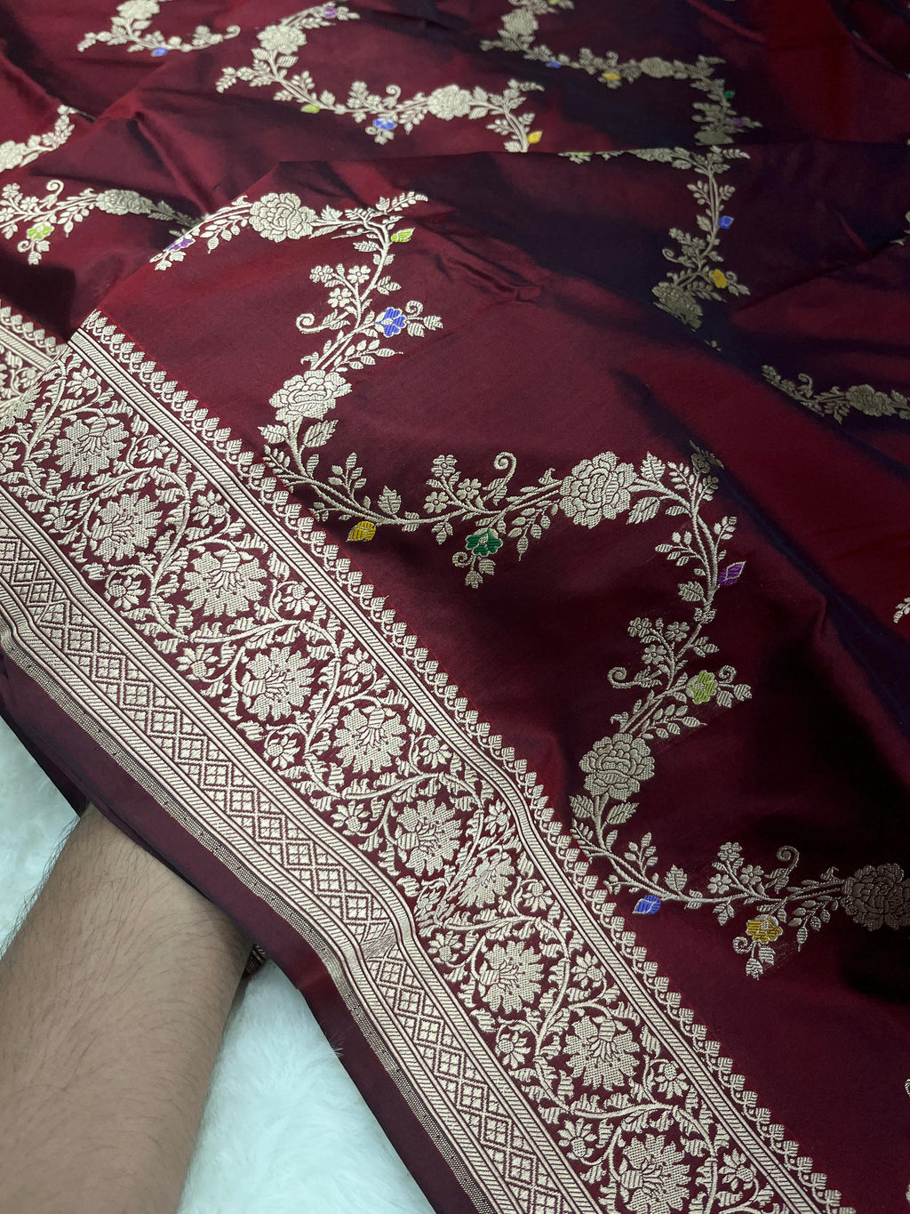 Maroon Banarasi Handloom Pure Katan Silk Kaduwa Jangla Meenakari Saree featuring intricate multi-color floral weaving and gold zari work.