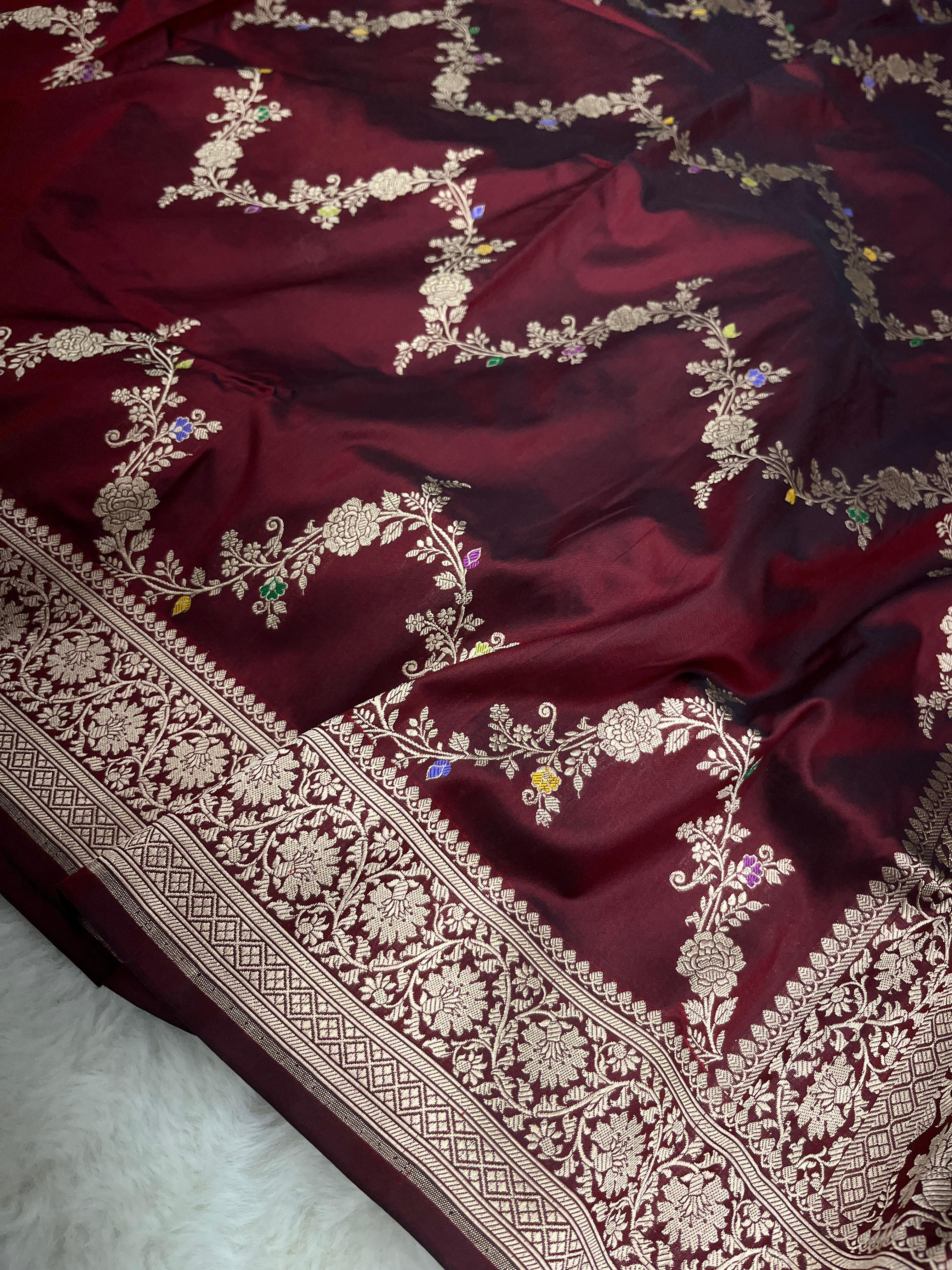 Maroon Banarasi Handloom Pure Katan Silk Kaduwa Jangla Meenakari Saree featuring intricate multi-color floral weaving and gold zari work.