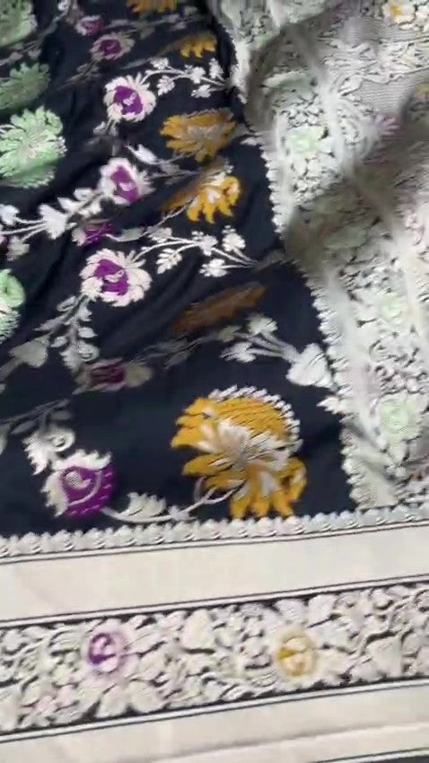 Midnight Black Handloom Banarasi Katan Silk Saree with Vibrant Meenakari Floral Motifs and Silk Mark Label.
